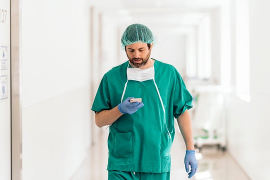 4167_Male Doctor Using Phone