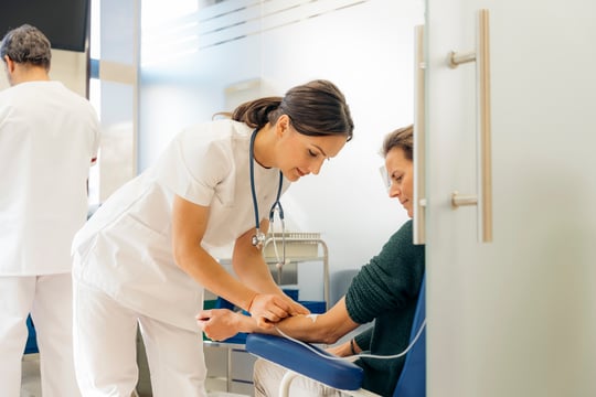 4180_Young woman doctor and female oncology patient