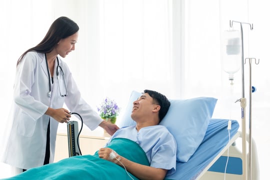 5486_Doctor checking patient’s blood pressure
