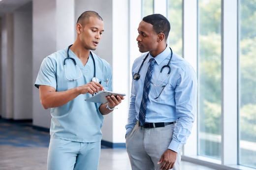 NP and PA clinicians consulting together