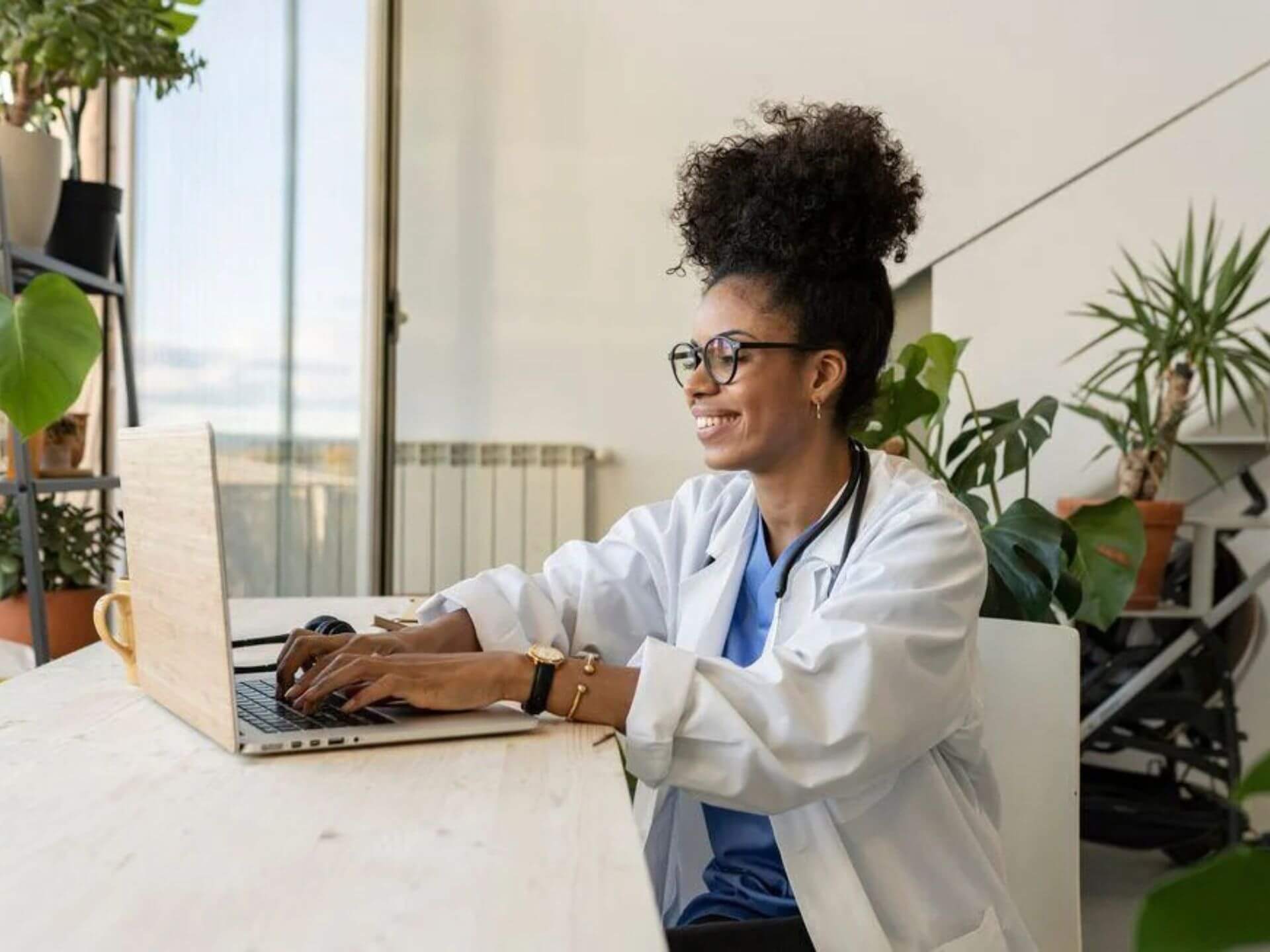 Doctor using laptop at home office