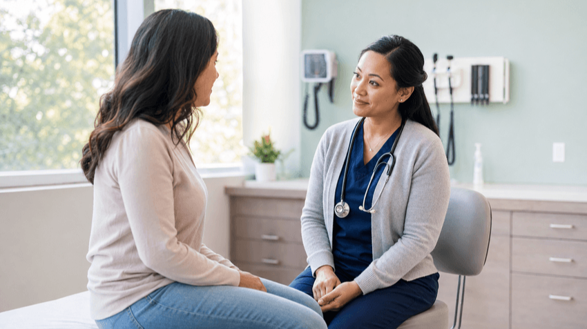 Nurse Practitioner Talking to Patient on Examination Bed