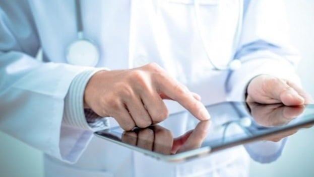 Healthcare worker using tablet