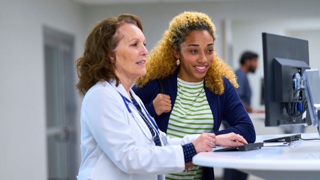 Doctor and patient looking at computer screen